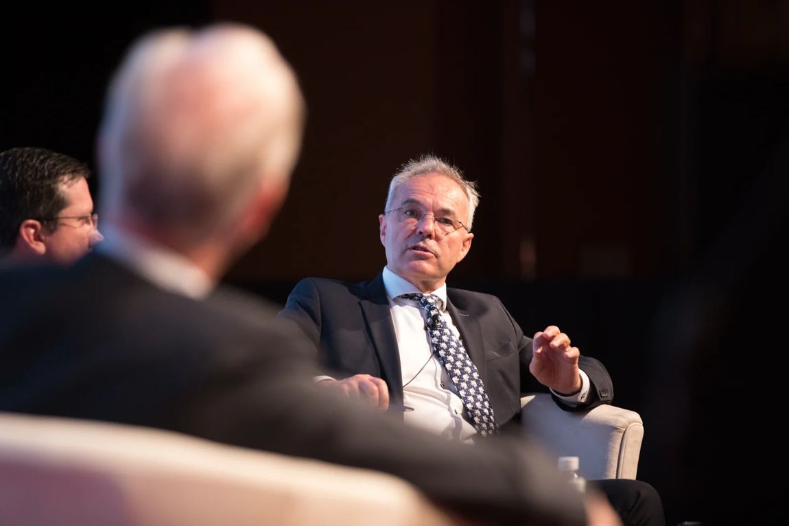 Speaker in a seated fireside conversation